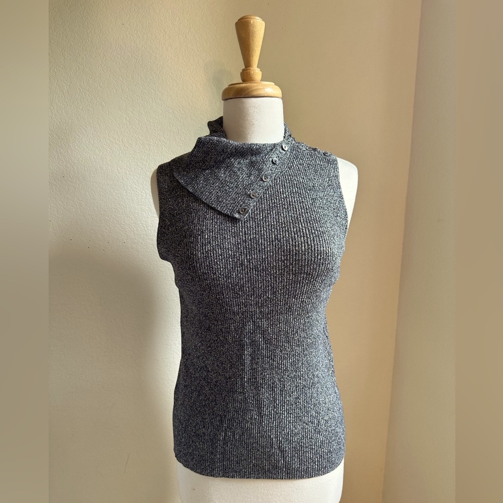 Gray sleeveless mock turtleneck blouse.